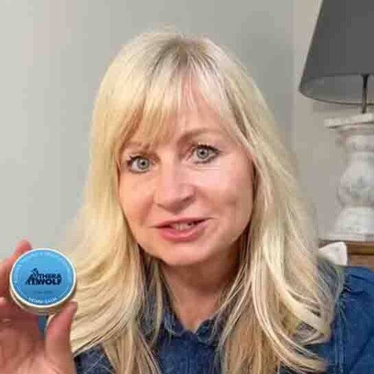 Woman holding Neuro Balm