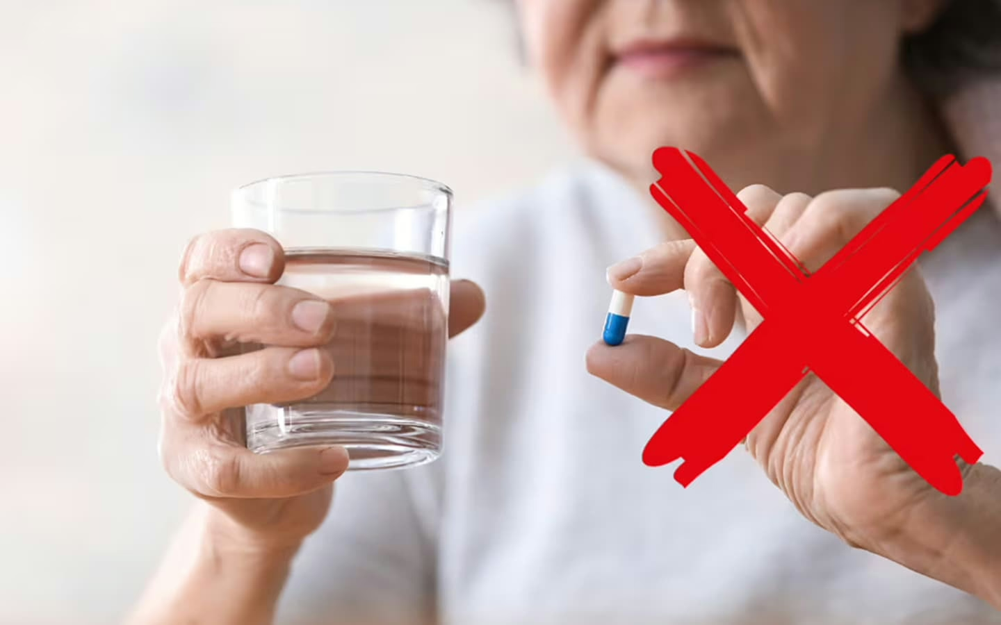 Image showing a glass of water with a pill crossed out